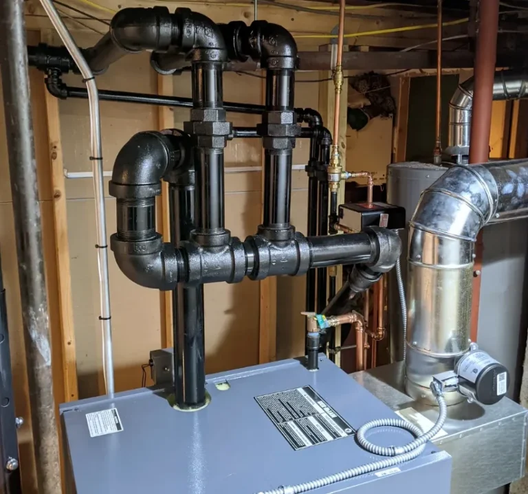 Close-up of steam boiler drop-header pipework